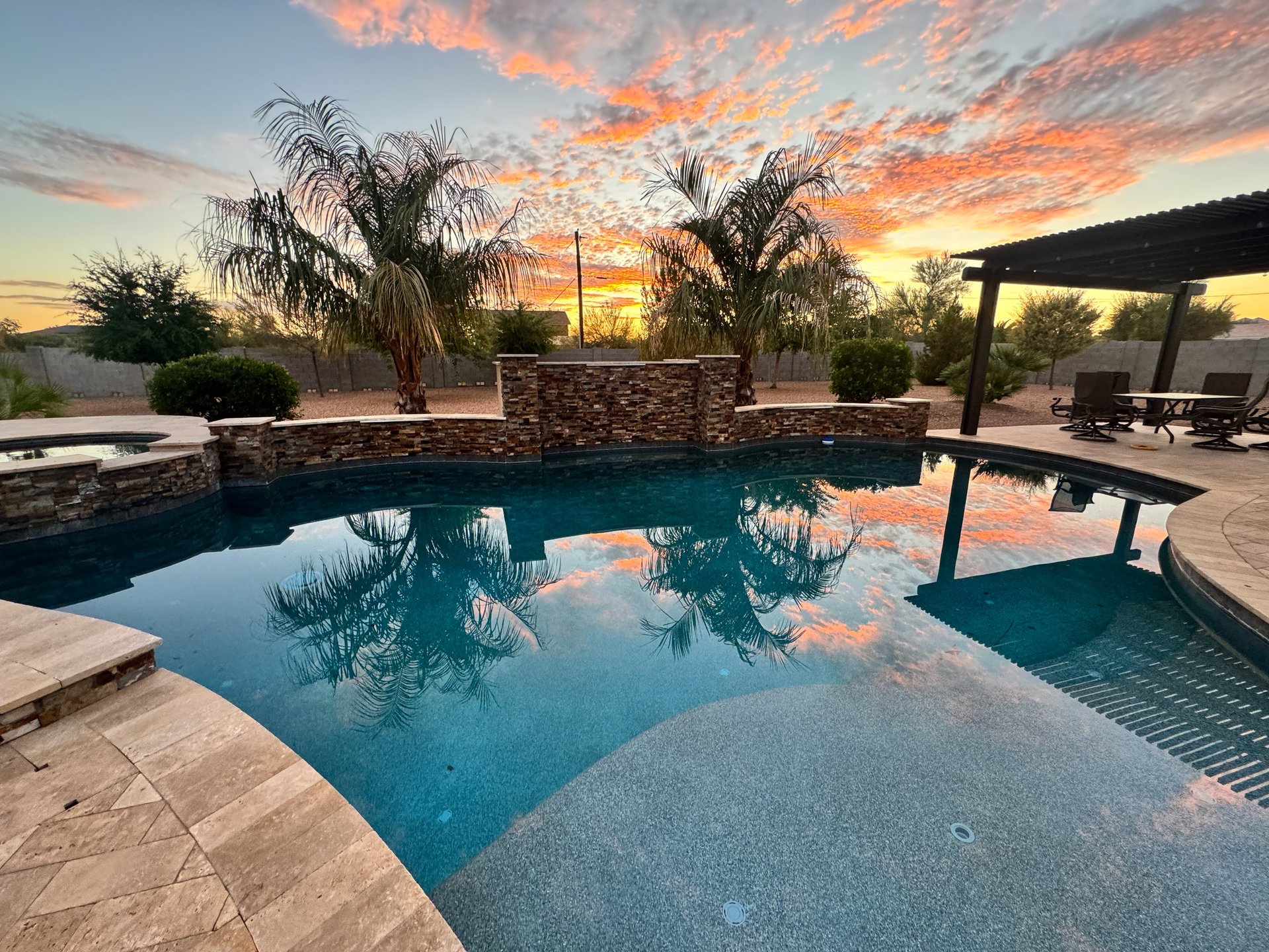 Luxury custom pool with desert sunset